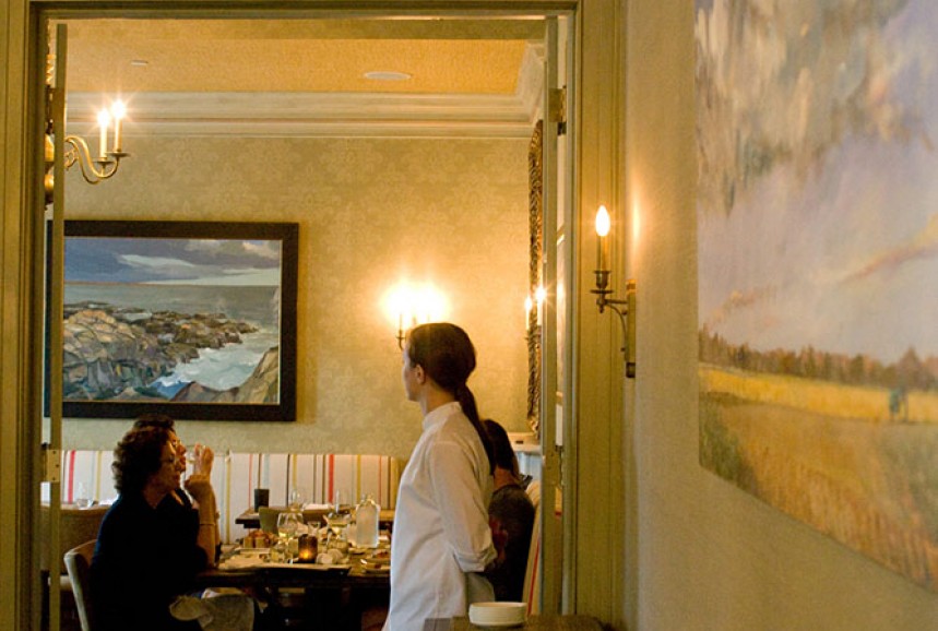 Server looking into the dining room, Max Moran paintings on the wall